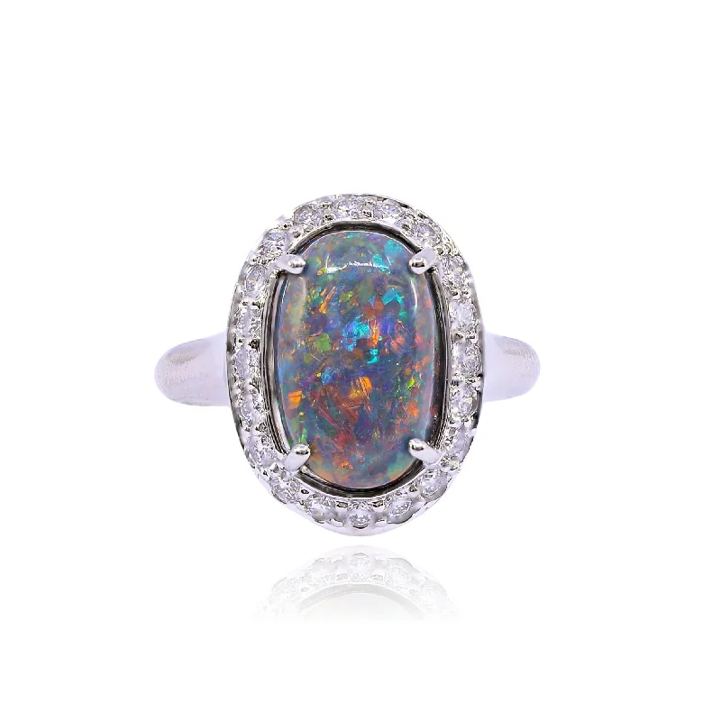 Handcrafted rings with raw emerald rough stones -ESTATE PLATINUM BLACK OPAL DIAMOND HALO RING